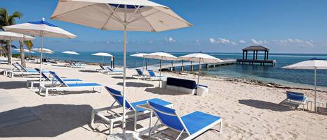 On the beach, sun loungers, beach towels
