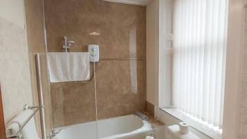 Shower, hair dryer, towels, shampoo