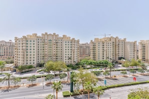 Stunning residential building with balconies and a landscaped garden.