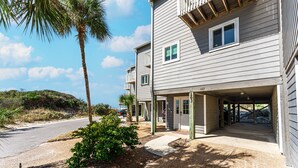A two-story building with a covered entrance and a small window. - We are ready to Sea Ya! on the Cape! 3/3.5 Gulf Front - SPECIALS! (Port St. Joe)