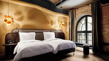 Luxe beddengoed, donsdekens, pillowtop-bedden, een minibar