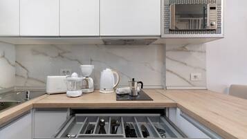 Fridge, microwave, stovetop, coffee/tea maker