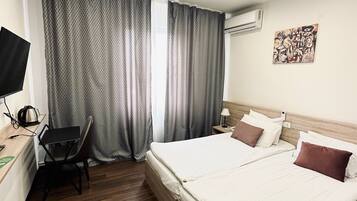 Down duvets, pillow-top beds, in-room safe, desk