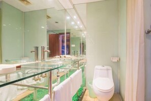 A modern bathroom with a glass-enclosed shower, a white toilet, and a glass vanity. - Junyi Hotel (Fuzhou Dongjiekou Metro Station, Sanfang Qixiang) (Fuzhou)