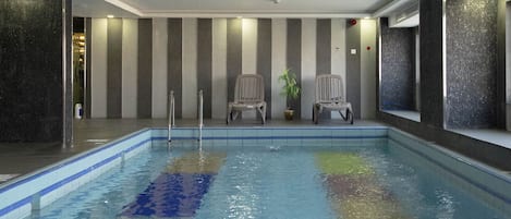 Indoor pool, open 7:00 AM to 7:00 PM, sun loungers