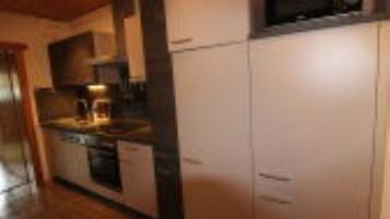 Enjoy cooking in this well-equipped kitchen with an oven and microwave.