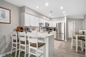 Fridge, microwave, oven, stovetop - Beautiful Three Bedroom Bayfront Condo with a Pool (Ocean City)