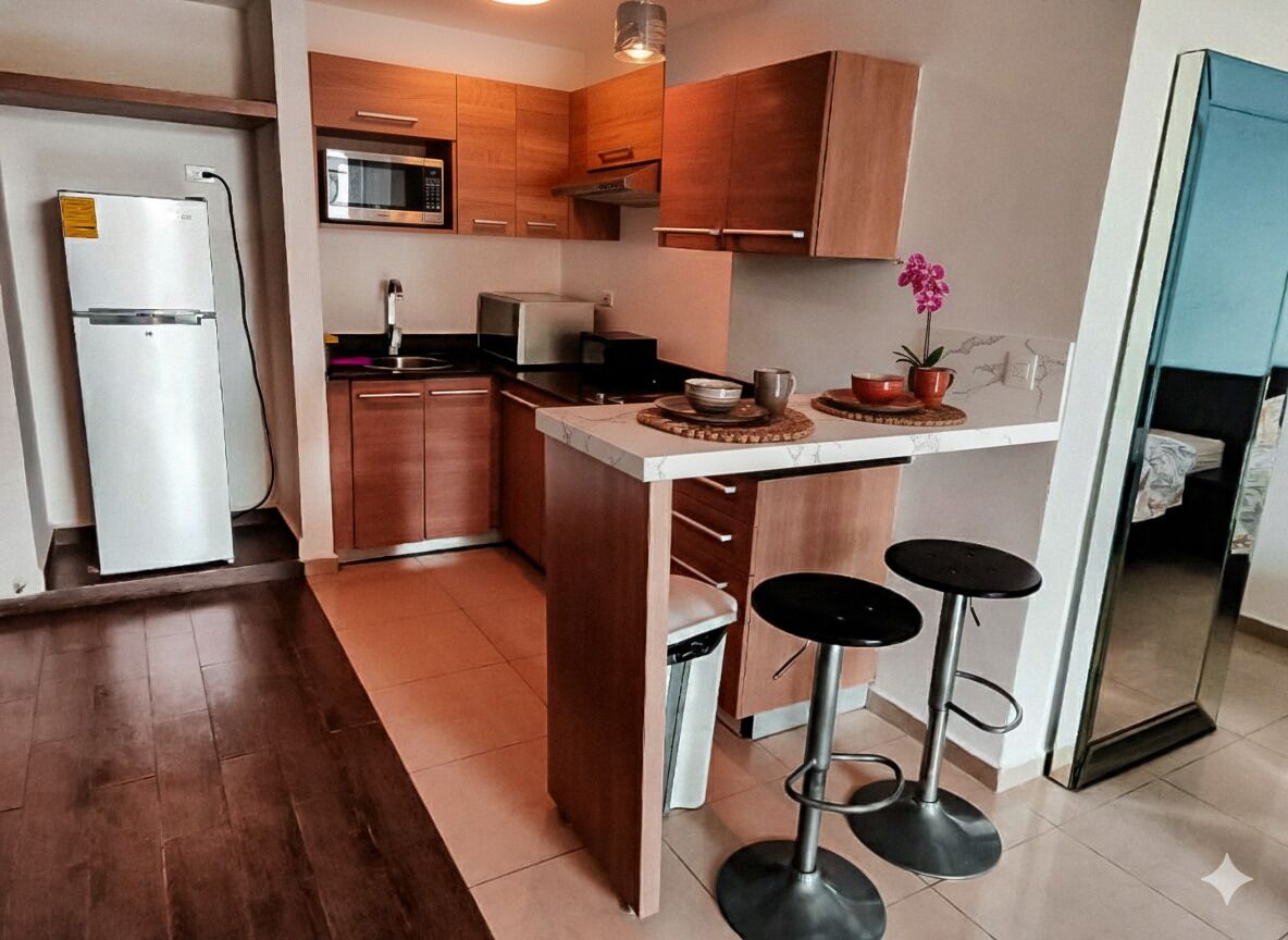 Fridge, microwave, stovetop, coffee/tea maker