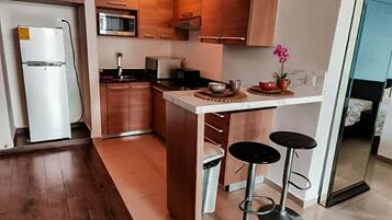 Fridge, microwave, stovetop, coffee/tea maker