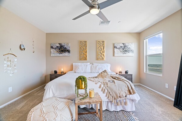 A bedroom with a bed, bedside tables, a ceiling fan, wall art, and a window. - 8 minutes from Las Vegas strip this is the best location to move around (Las Vegas)