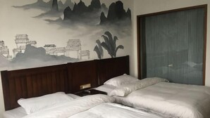 A hotel room with two beds, a wooden headboard, and a wall mural depicting traditional architecture and nature. - Tianyi Hotel Zhangjiajie (Zhangjiajie)