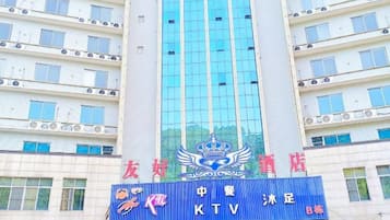 A multi-story building with a prominent blue sign featuring a crown emblem and the text 'KTV'.
