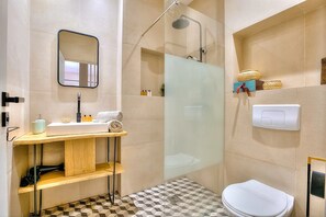Shower, hair dryer, towels, soap