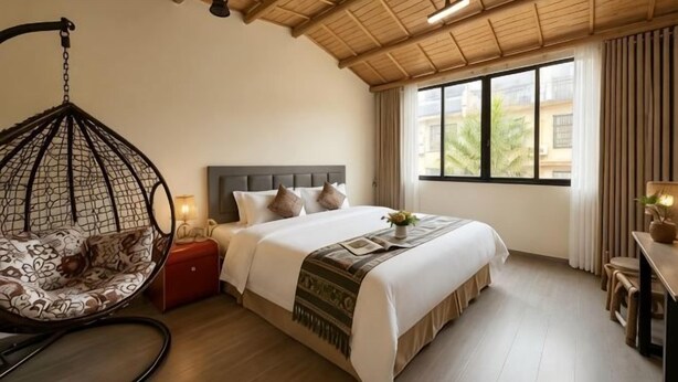 A bedroom with a hanging chair, a bed with pillows, a bedside table, and a window with curtains. - Fenglin Art Hotel (Pingle)