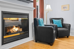 Classic Room, 1 King Bed | Living area | 24-inch flat-screen TV with cable channels, TV