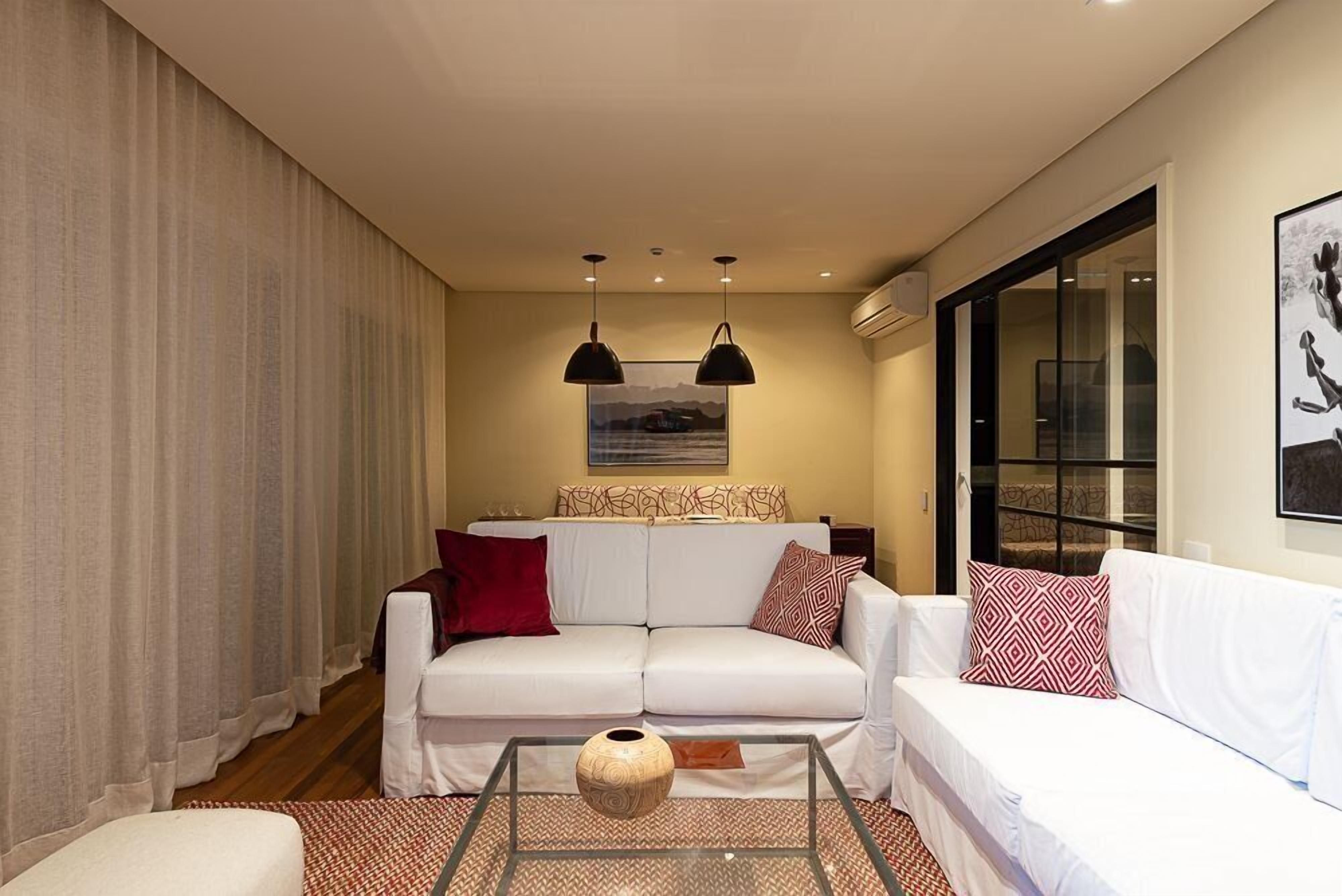 Deluxe Apartment | Living area | 40-inch TV with satellite channels