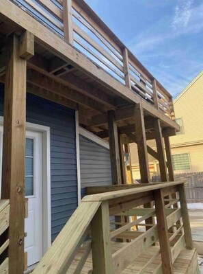 Enjoy the outdoor space with a deck and steps leading up to the entrance.