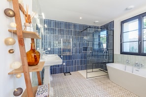 Shower, hair dryer, towels, soap