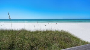 A beach with white sand and clear blue water. - WaterColor Home - Near Beach and Pools! (Santa Rosa Beach)