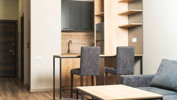 Standard Room | Living area | 55-inch Smart TV with digital channels, TV