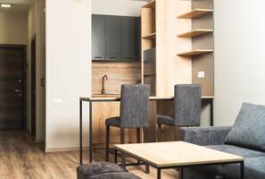 Standard Room | Living area | 55-inch Smart TV with digital channels, TV - Forest Apartments Hotel (Tsaghkadzor)