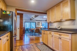 Enjoy meals in the kitchen with a central island and dining area nearby.