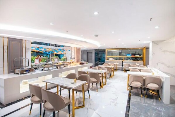 A modern restaurant with a bar area, marble flooring, and contemporary furniture.