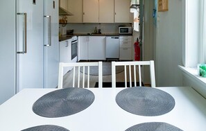 Fridge, stovetop, dishwasher, coffee/tea maker