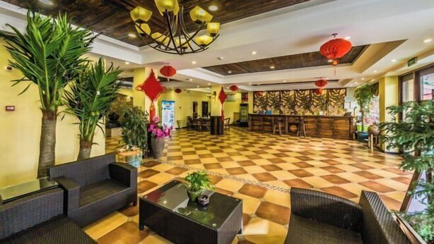A lobby with checkered flooring, wicker furniture, a central chandelier, and red lanterns. - Fu'an Bojing Hotel (Fu'an)