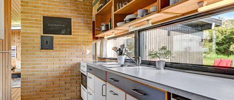 Fridge, stovetop, coffee/tea maker