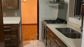 Family House | Private kitchen | Microwave, cookware/dishes/utensils, dining tables