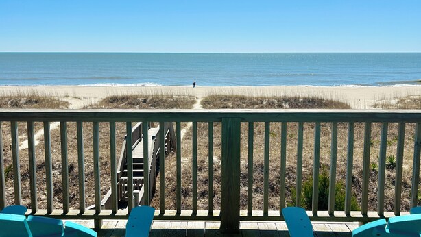 A wooden deck with a view of the beach and ocean. - Pet Friendly, Ocean Front w/ Heated Private Pool and Sun Deck (Brunswick)