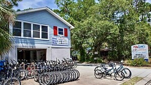 A building with a sign indicating it is a bike rental service.