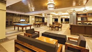 A spacious lobby with a pool table, seating areas, and a bar. - Fantastic 3 bedroom Tivoli Garden Residences (Mandaluyong)
