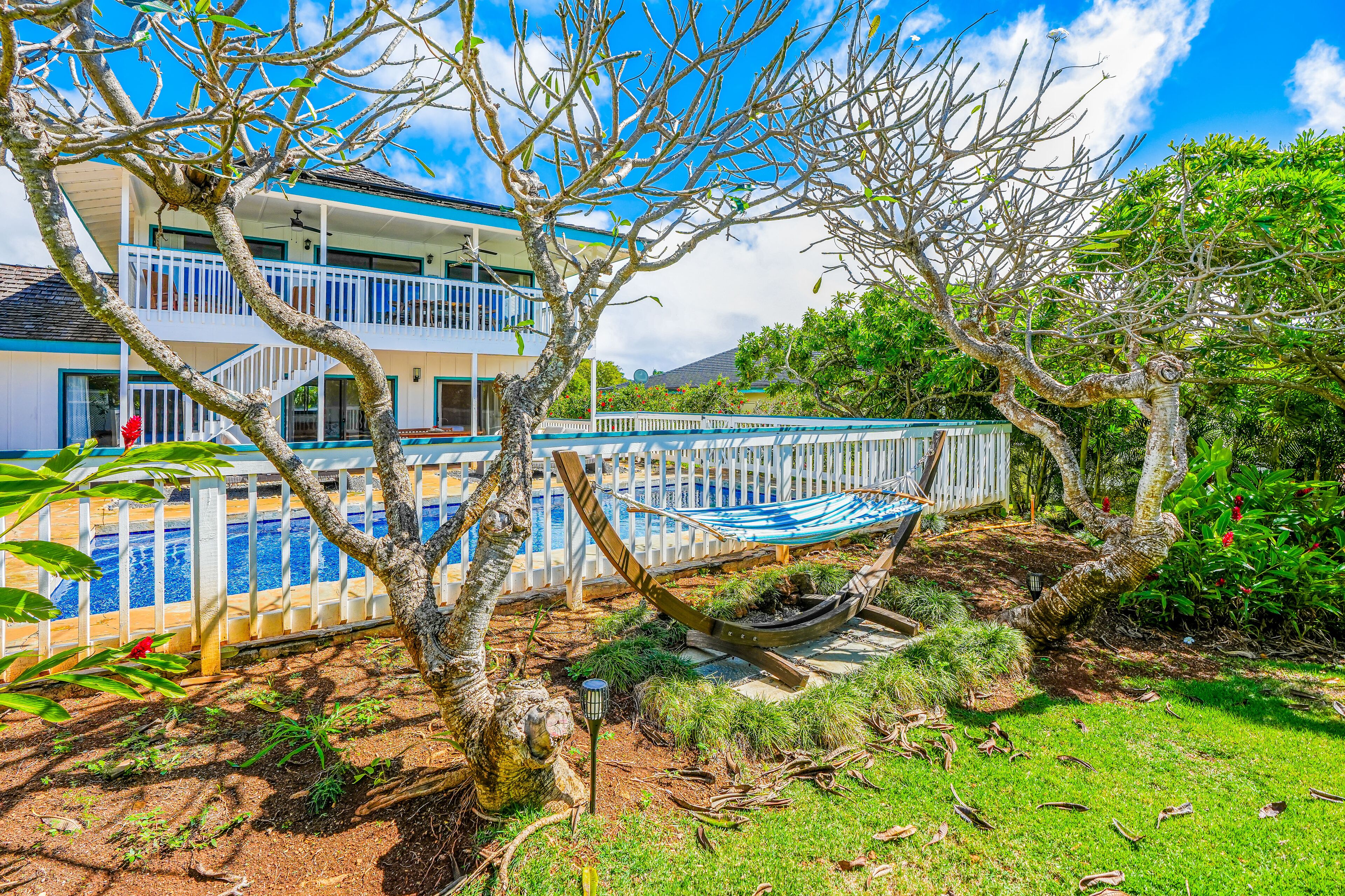 Enchanting home with pool, hot tub, lanai, balcony, golf nearby, & washer/dryer