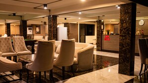 A spacious lobby with a billiards table, plush seating, and a reception desk. - Anandpura Riverside Hotel (Bangkok)