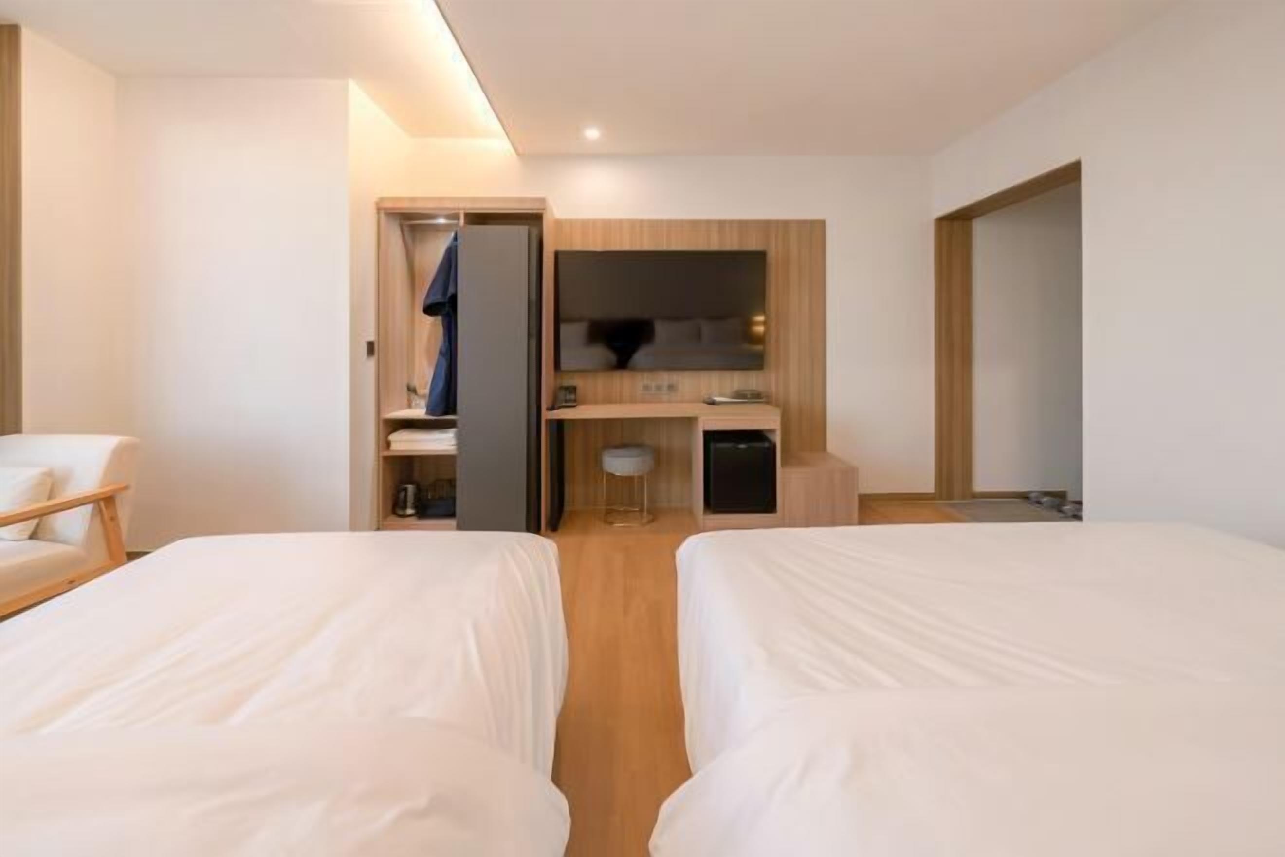 Premium bedding, desk, laptop workspace, free WiFi