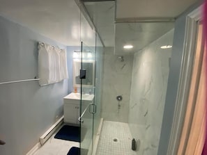Shower, hair dryer, towels, soap