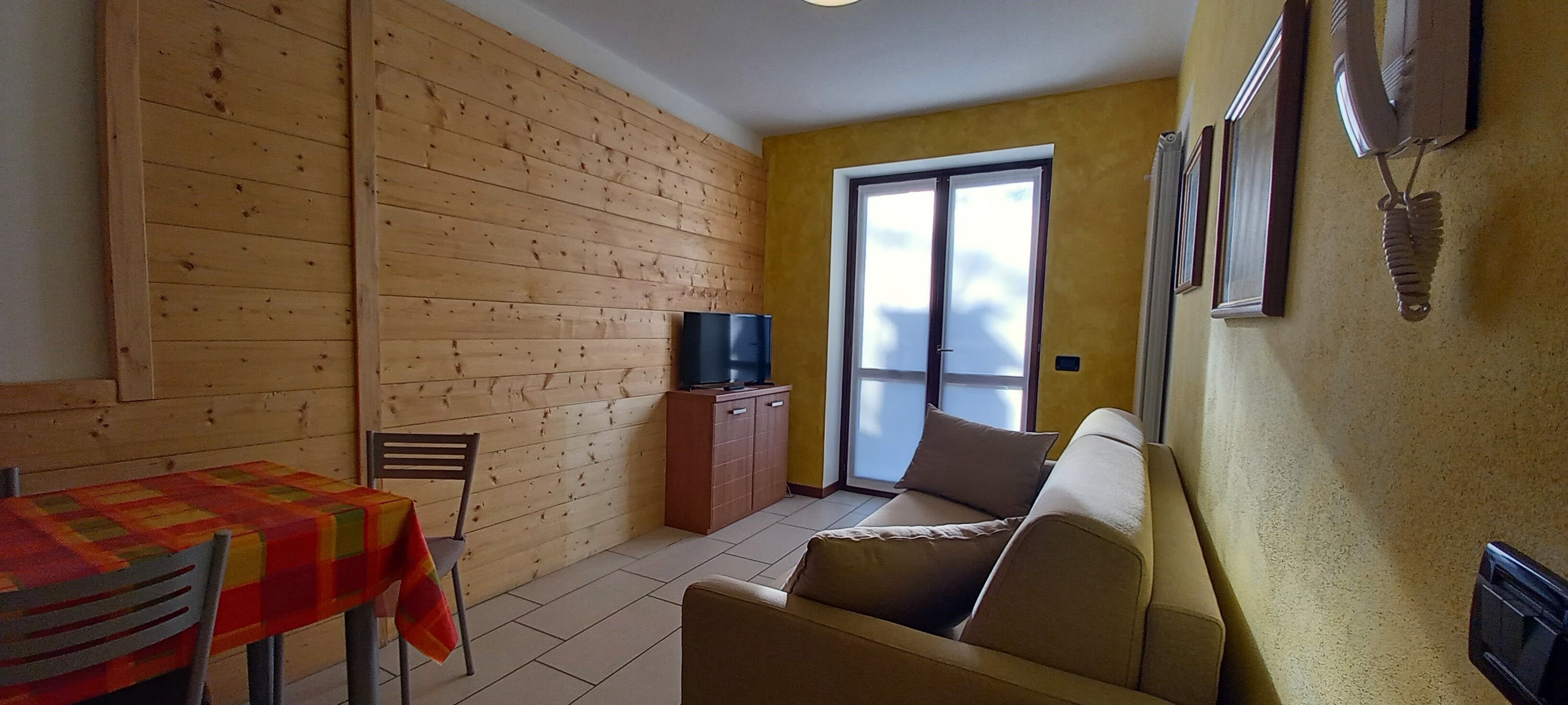 Standard Apartment | Living area | 28-inch flat-screen TV with digital channels, TV