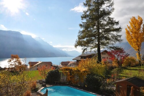 House with beautiful lake view, garden and pool