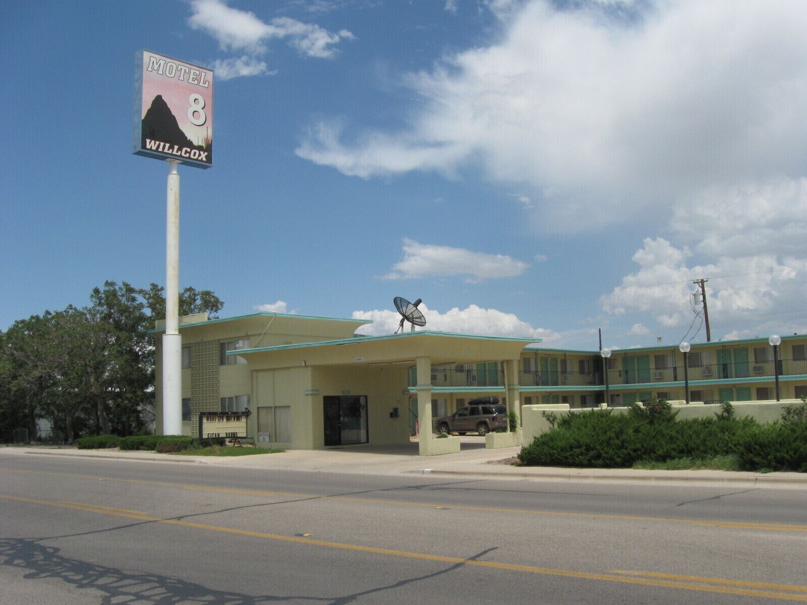 A motel with a sign indicating it is number 8 in Willcox.