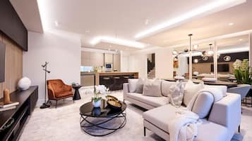 Penthouse básico | Área de sala de estar | Smart TV de 65 pulgadas con canales digitales, televisión y Netflix 