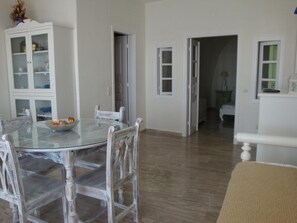 Apartment Caldera View Share Jetted Tub | Living area | 30-inch flat-screen TV with digital channels, TV - Captain John Traditional Houses - Adults Only (Santorini)