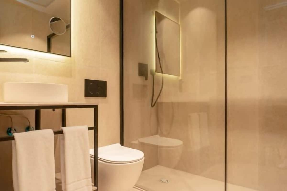Rainfall showerhead, designer toiletries, hair dryer, bathrobes