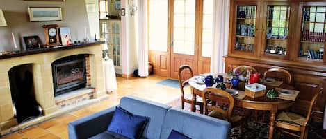 TV, fireplace, books, printers
