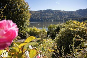 Escape to a serene lakeside retreat surrounded by lush greenery and tranquil surroundings.
