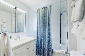 Jetted tub, eco-friendly toiletries, hair dryer, towels