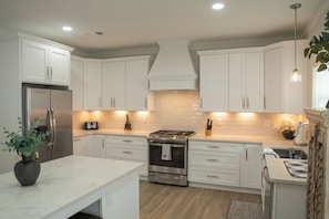 Fridge, microwave, oven, stovetop - "Lil House" Cozy 2-bedroom cottage walking distance to beach and downtown. (Bay St. Louis)