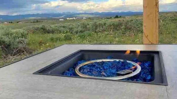An outdoor fire pit with a clear view of the surrounding landscape.