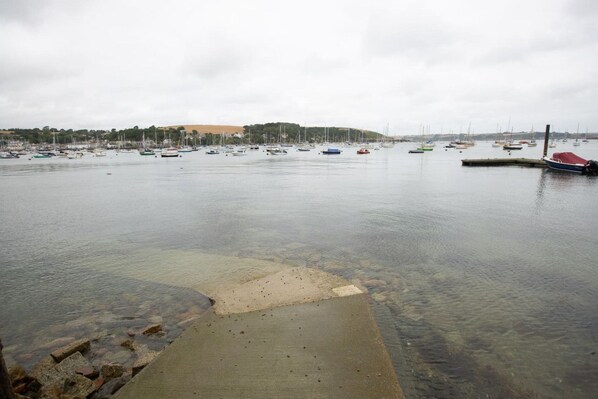 A marina with boats docked and a clear view of the water.